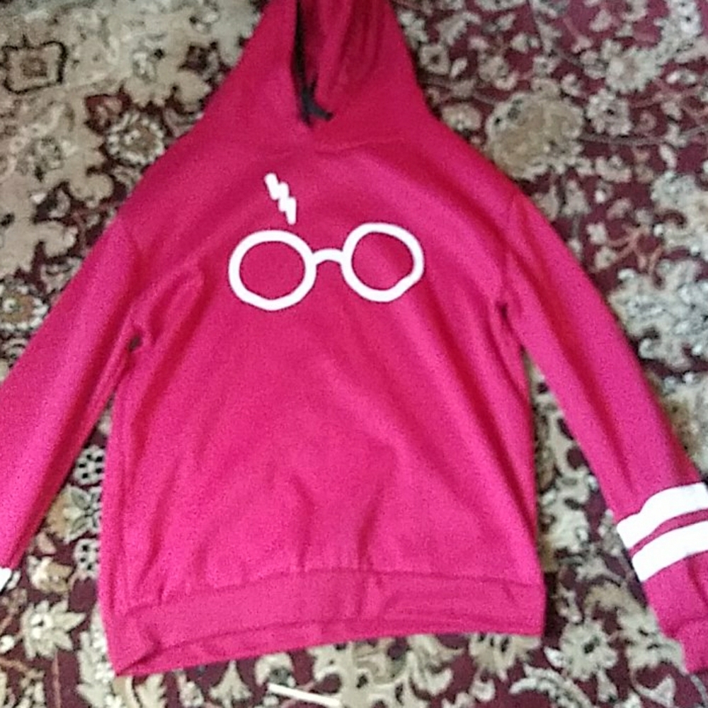 A maroon hoodie,